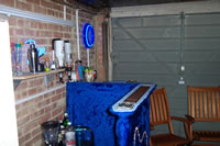 The bar...WOW. Its blue, and it has...chairs near it.